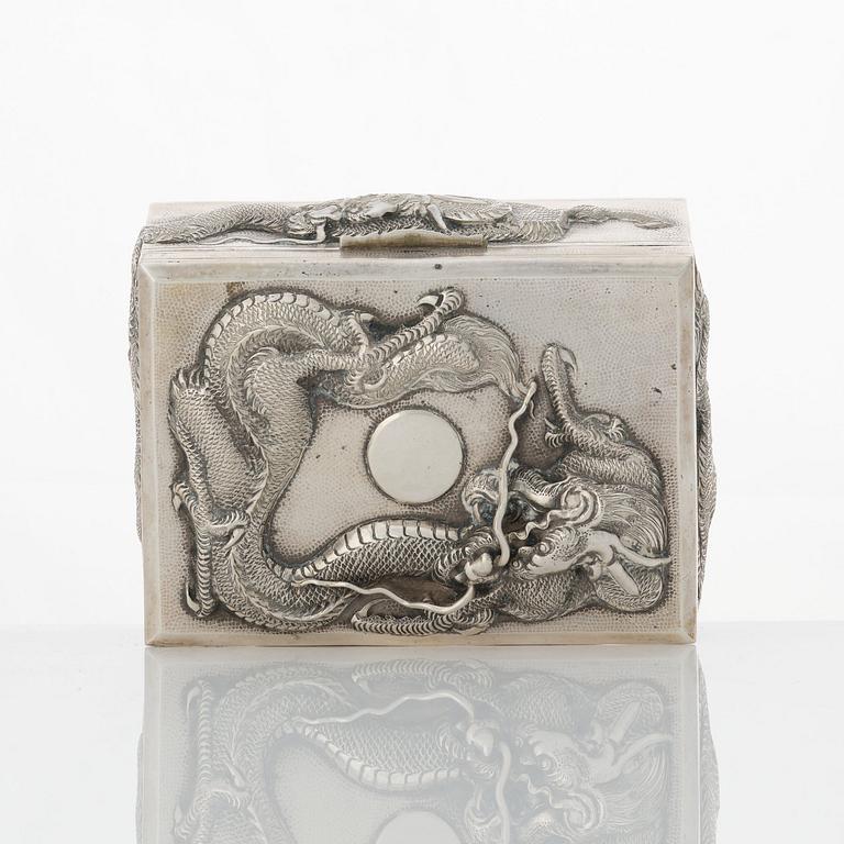 A set with 2 Chinese silver boxes, a coaster and a match stick holder, 20th Century.