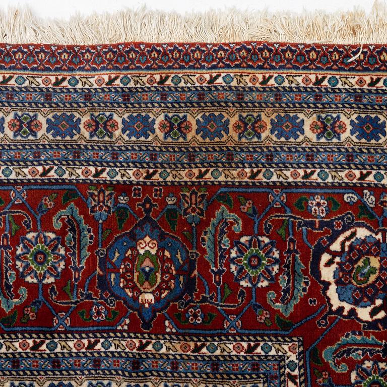 An oriental carpet, c. 371 x 264 cm.