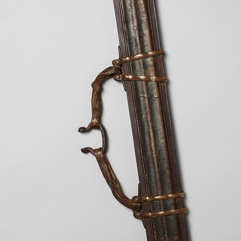 A Tibetan classig long broad blade sword with scabbard, 19th Century.