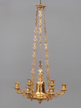 A CHANDELIER, For sex candles. Fire gilded. Empire style, early 19th century.