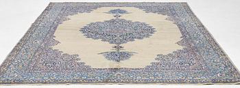 A semi-antique Kerman carpet, figural, c. 371 x 285 cm.