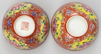 A pair of coral-ground famille rose bowls, Qing dynasty (1644-1912), one with seal mark in red.