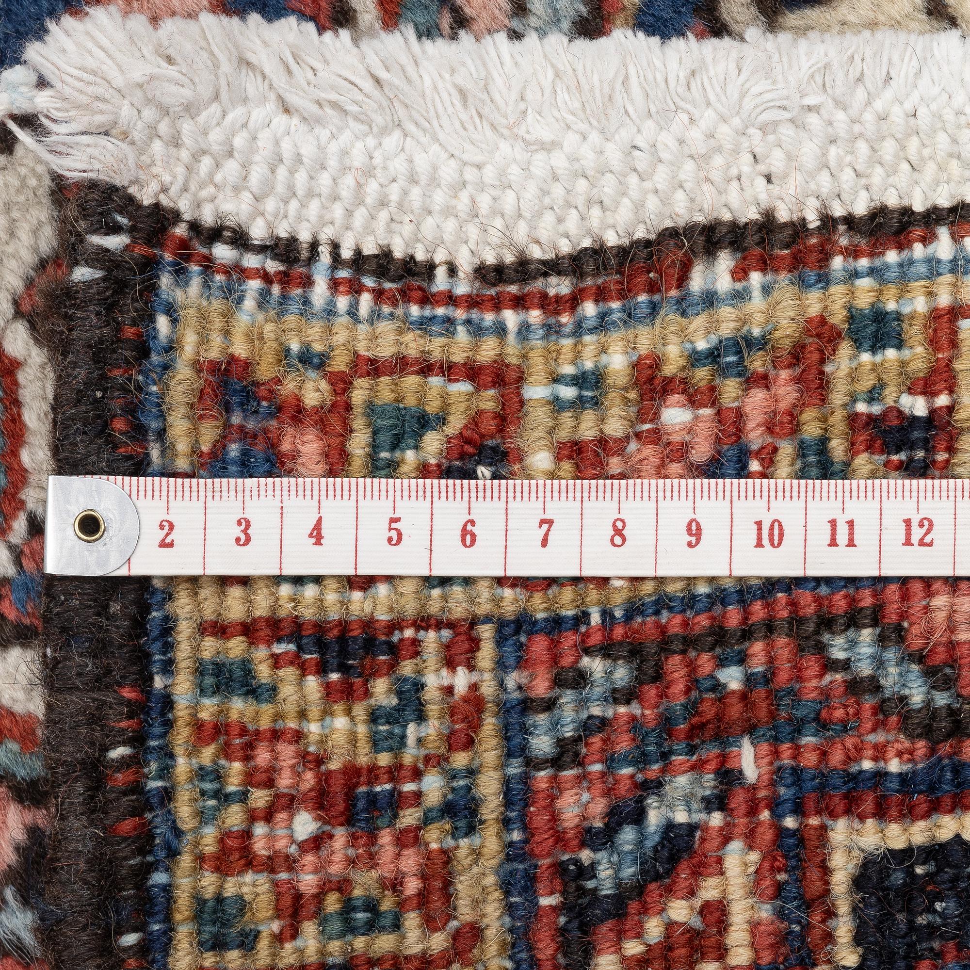 A semi-antique Ahar carpet, North west Persia, c. 410 x 300 cm.