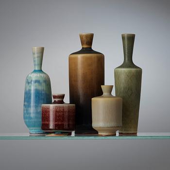 A Berndt Friberg set of 24 miniature stoneware vases and bowls in a teak casket, Gustavsberg Studio.