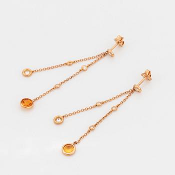 Yellow sapphire and brilliant-cut diamond earrings.