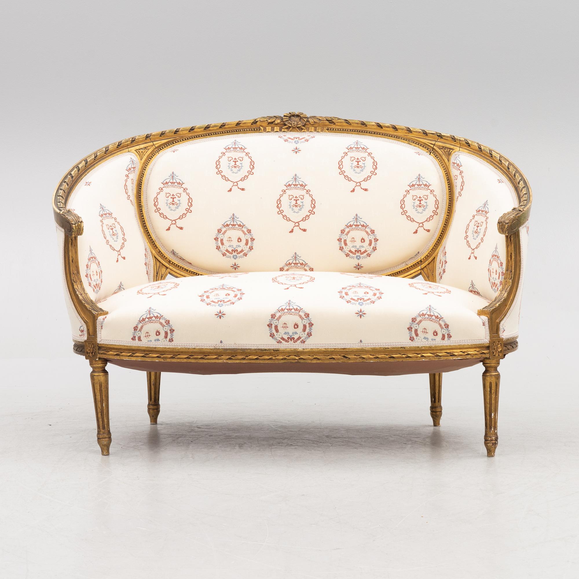 A Gustavian style sofa with two armchairs and two chairs, 20th century.
