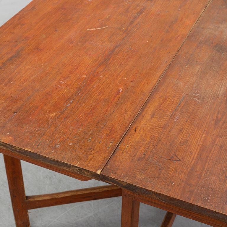 A pine gate leg table, 19th Century.