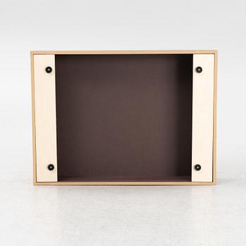 A 'Mass Wide' walnut veneered coffee table from New Works.