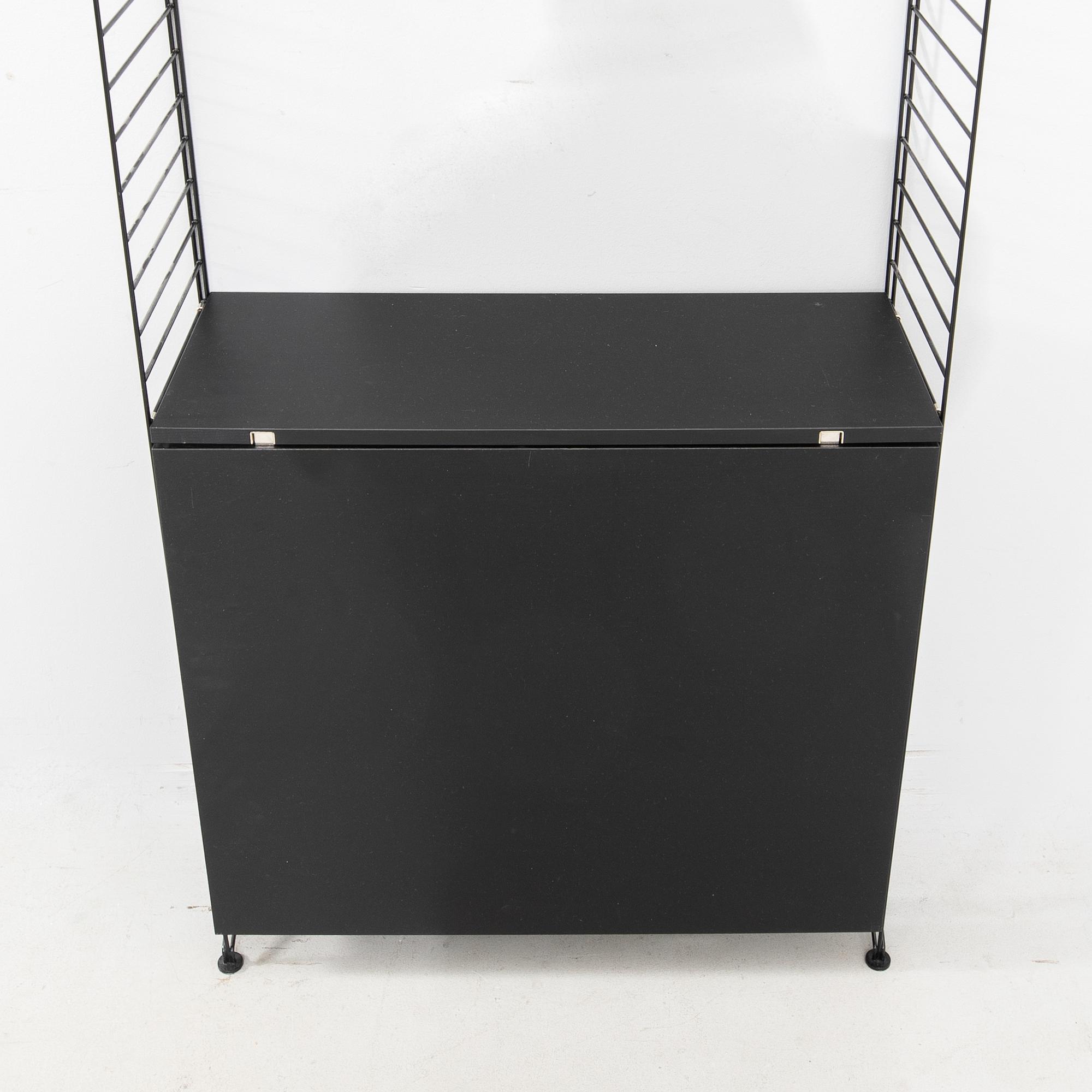 Nils Strinning, Hyllsystem.