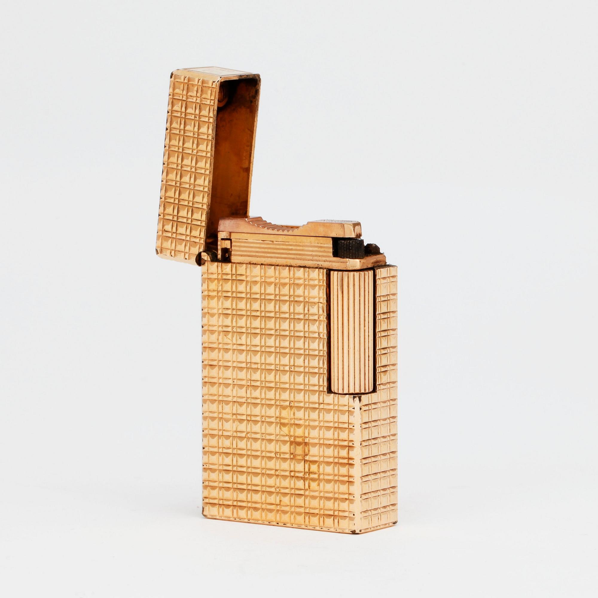 S T DUPONT, a gilded metal ligther.