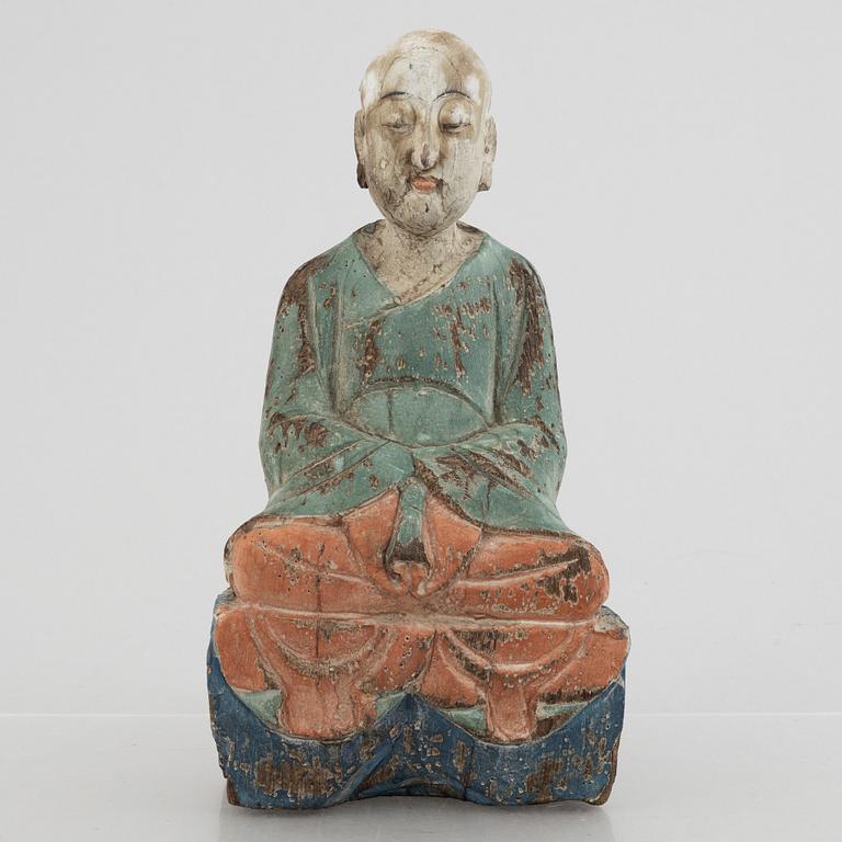 A Louhan, carved and painted wood, China, late Qing dynasty.
