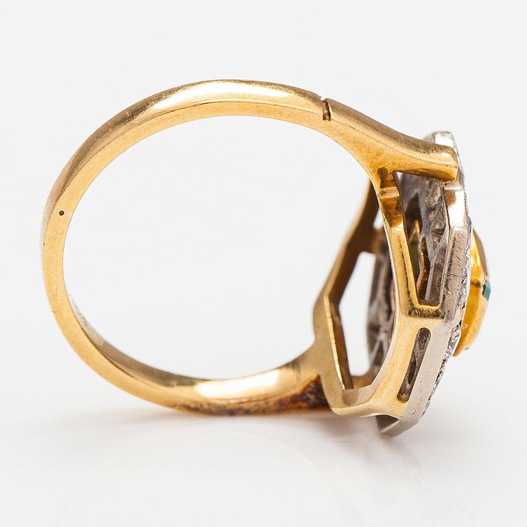 A 17-18K gold ring with an emerald and diamonds ca. 0.56 ct in total. Russia.