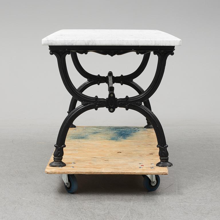 An end of the 20th Century aluminum and marble garden table.