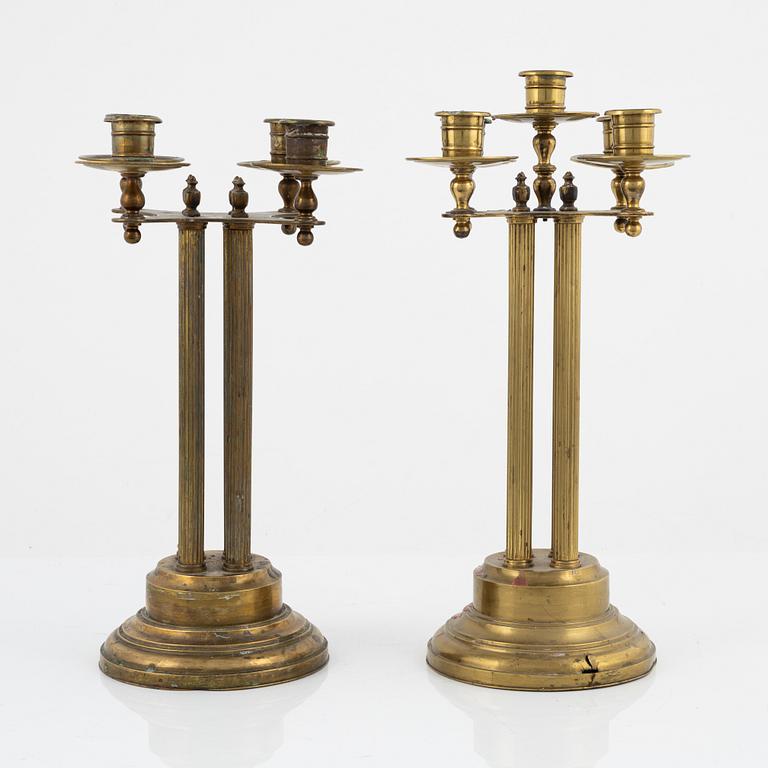 A pair of brass candelabras, first half of the 20th century.