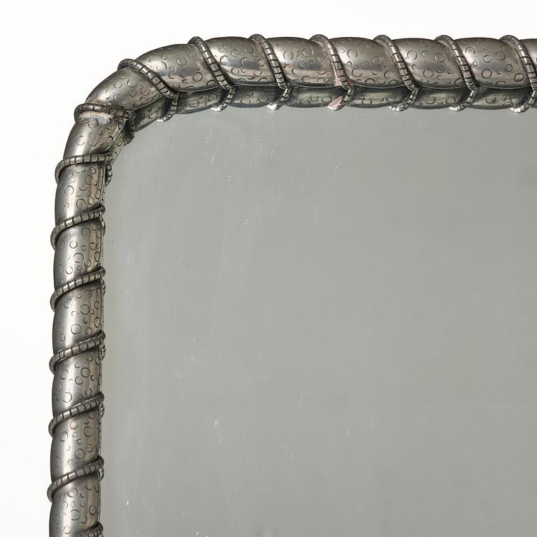 Estrid Ericson, a pewter framed mirror model "A 2518", Firma Svenskt Tenn, Stockholm, 1947.