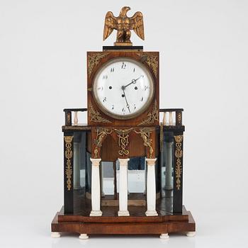 A Biedermeier mantel clock, first half of the 19th Century.