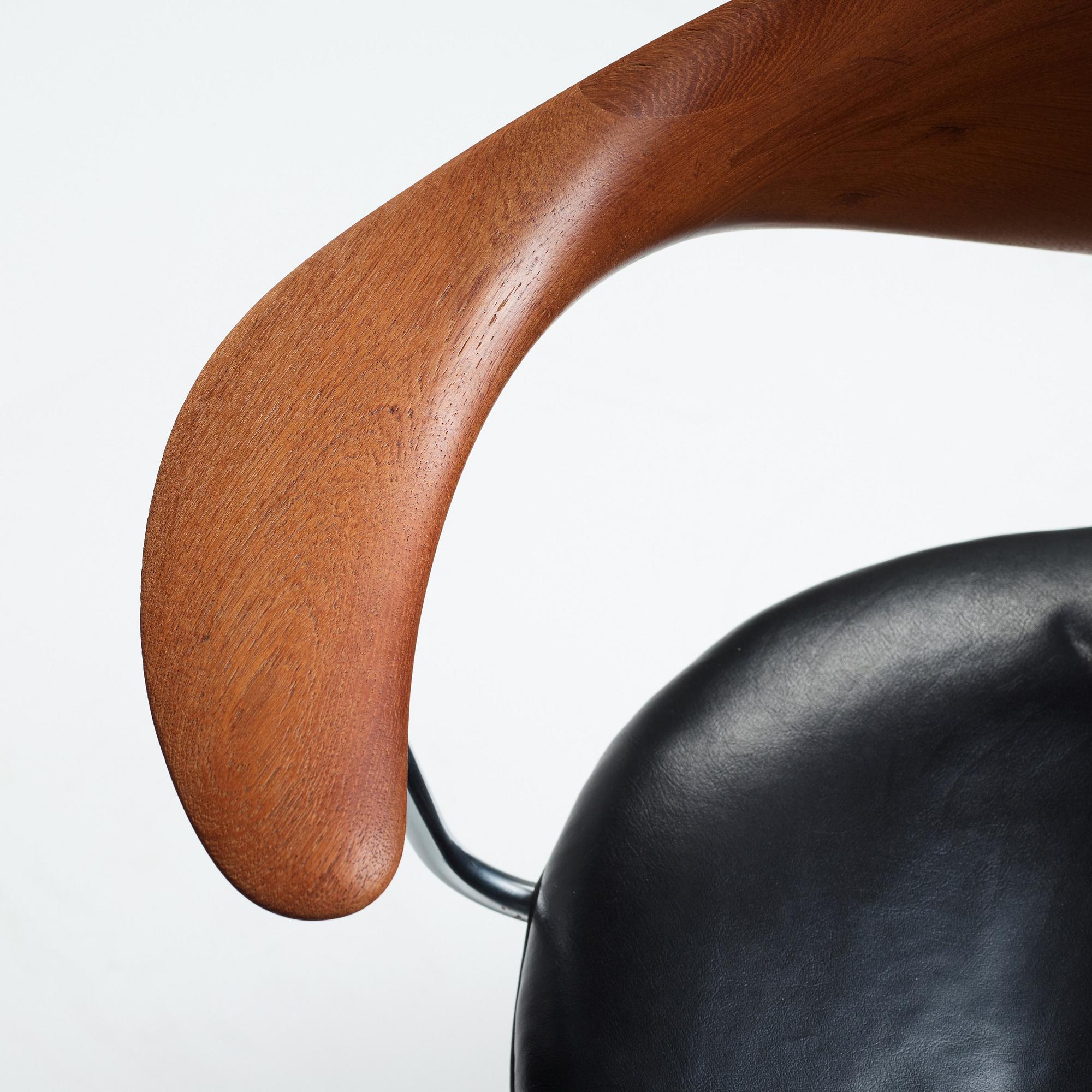 Hans J. Wegner, a "Swivel Chair" /JH502, executed by Johannes Hansen, Denmark 1960's.