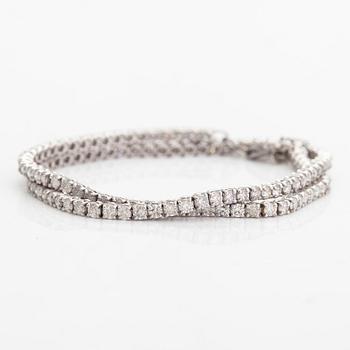 Tennishalsband/-armband, 14K vitguld och diamanter ca 6.96 ct tot. AIG-certifikat.