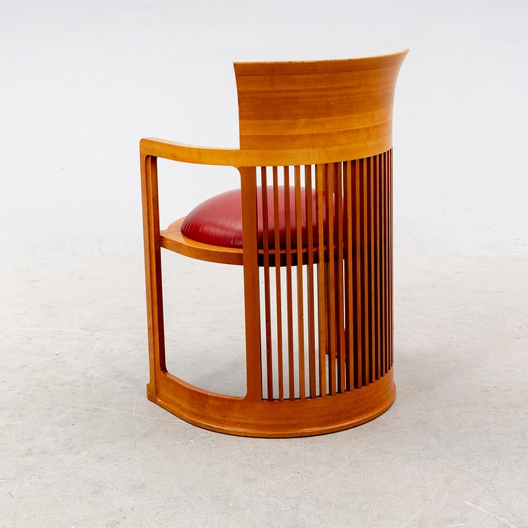 A cherry wood model 606 'Barrel' chair by Frank Lloyd Wright from Cassina.