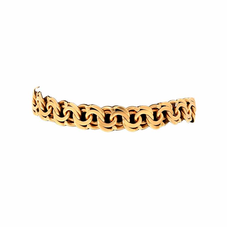 An 18K gold Bismarck bracelet.