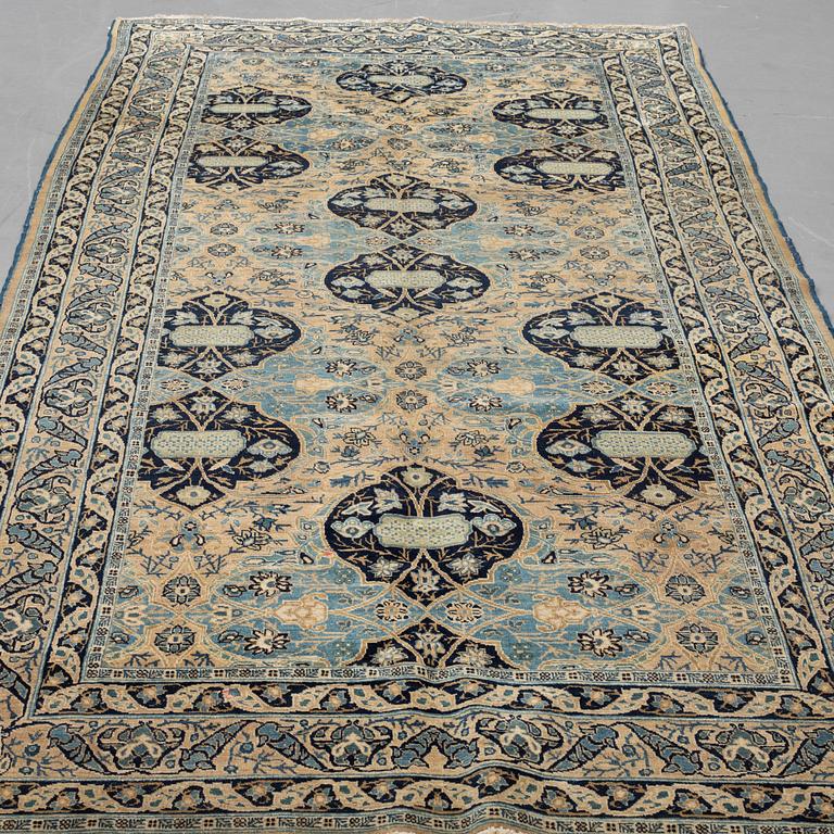 A carpet, semi-antique Kohrasan, ca 380 x 173 cm.