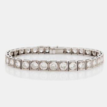 1065. A platinum bracelet set with round brilliant-cut diamonds.