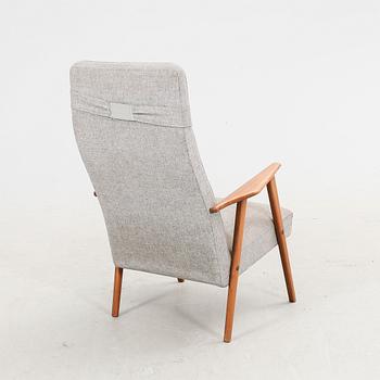 A 1960s teak armchair.