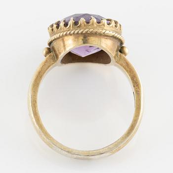 A set with a necklace, a bracelet, a brooch, and a ring.