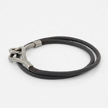 Hermès, a 'Jumbo' leather bracelet and a silk scarf.