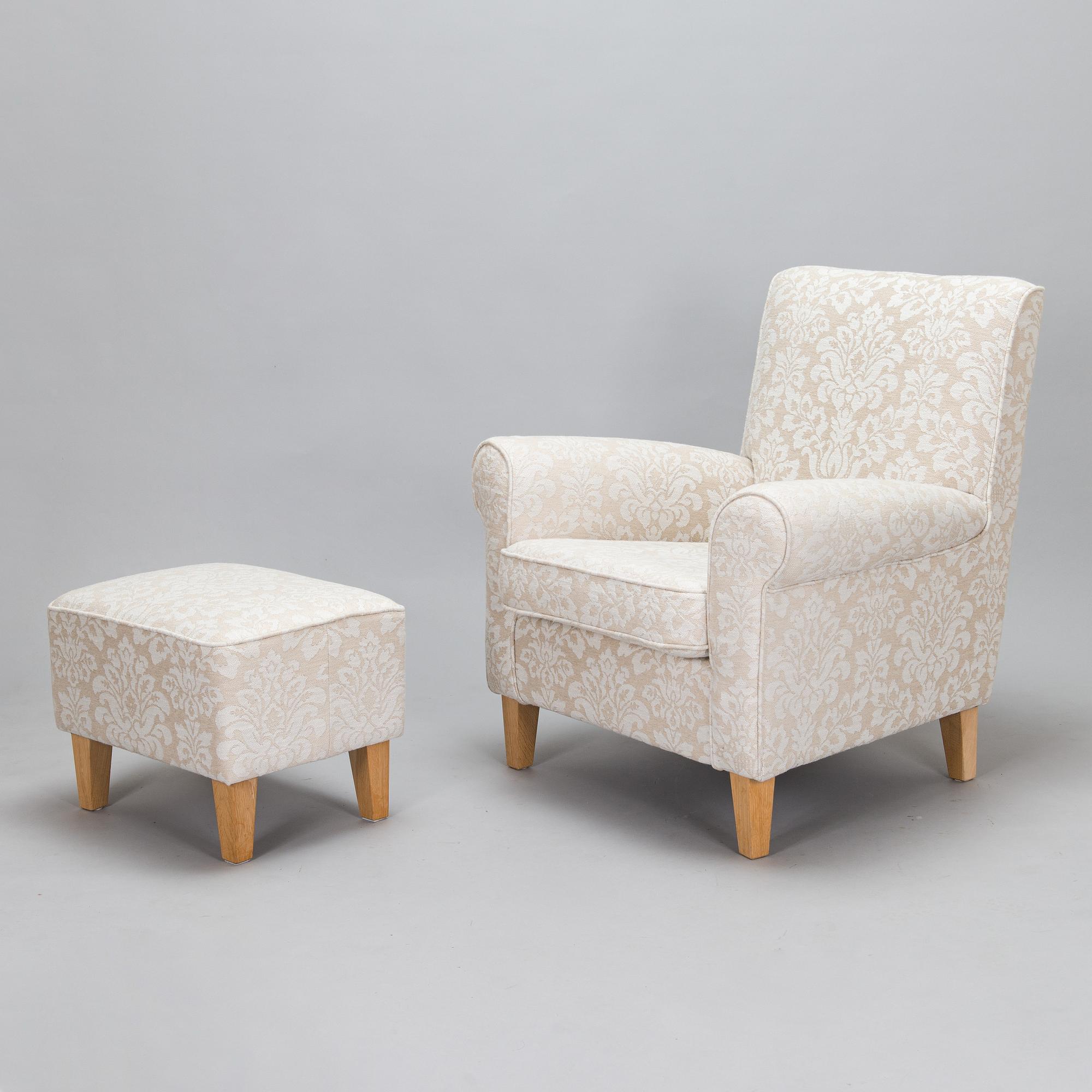 A mid-20th-century armchair and ottoman.