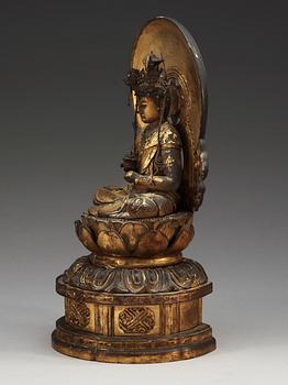 A Japanese gilt wooden seated figure of Buddha, 19th Century.