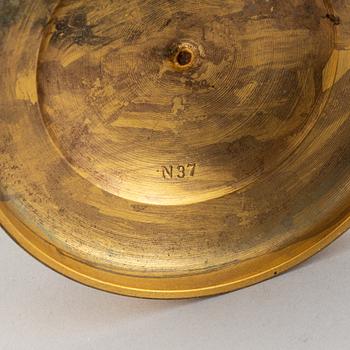 A pair of French Empire candlesticks.