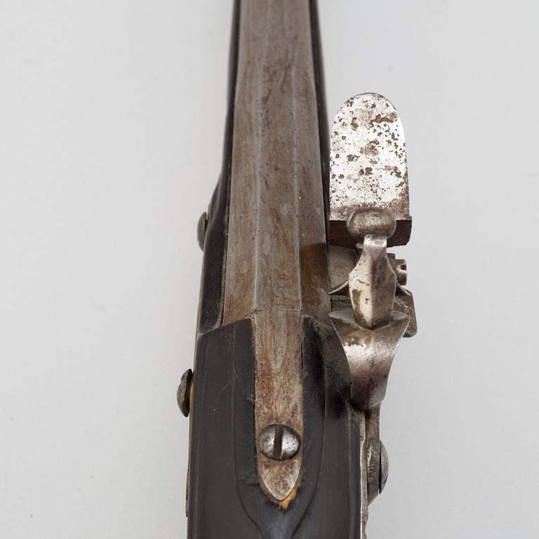 A 18th century flintlock pistol.