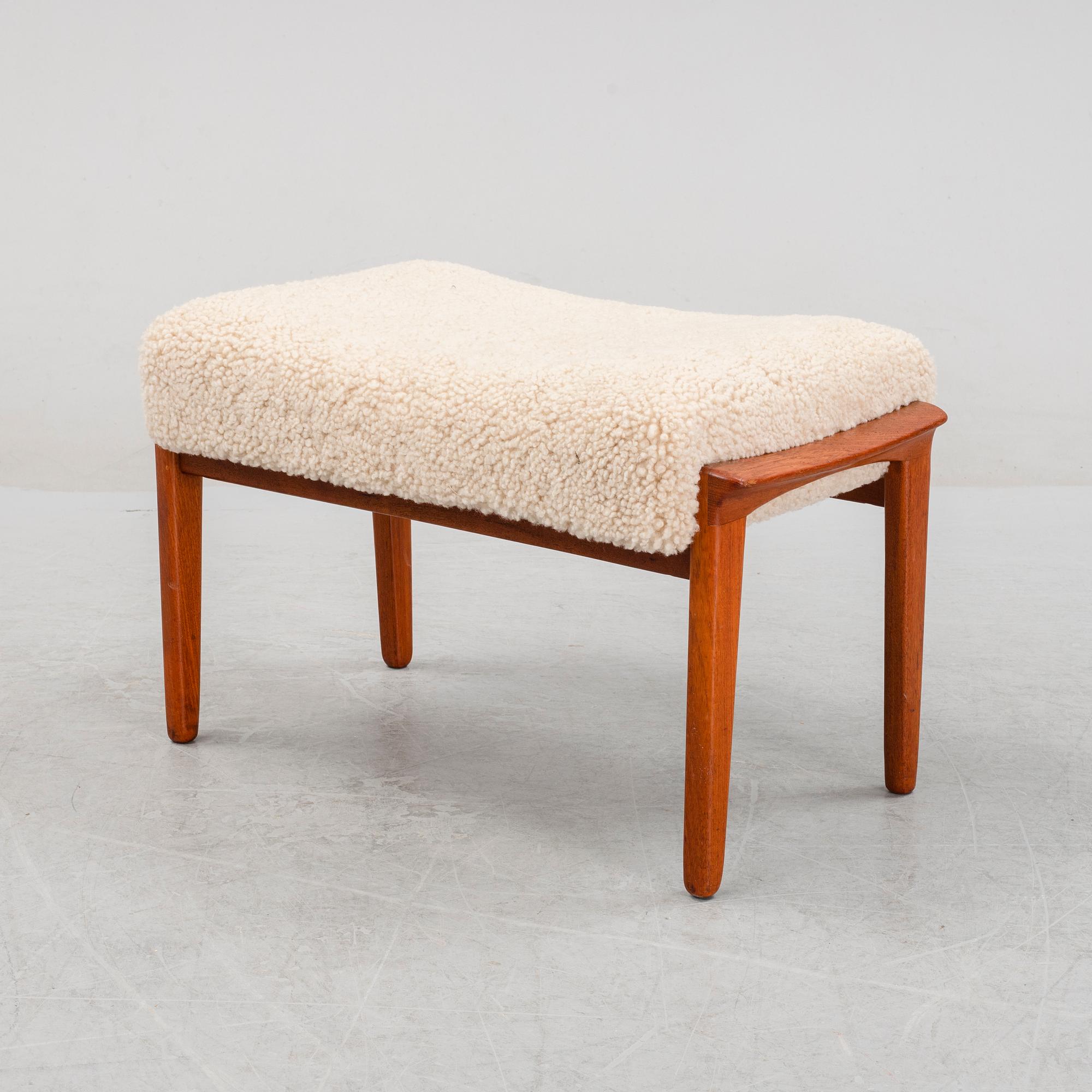 A Danish mid 20th Century sheepskin upholstered ottoman.