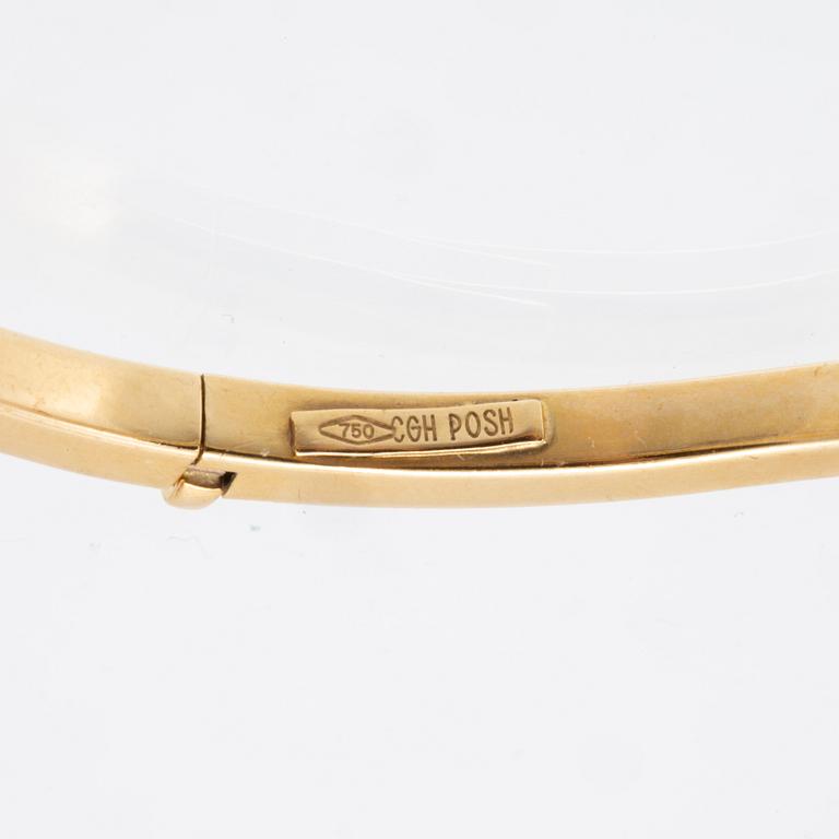 An 18K gold bracelet.