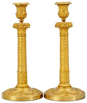 1039. A pair of Empire candlesticks.