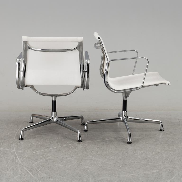 A pair of 'EA 108' desk chairs by Charles & Ray Eames for Vitra.