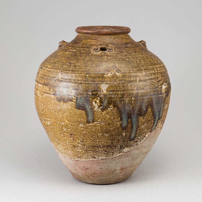 A olive green glazed jar, South East Asia, 18th Century or older.