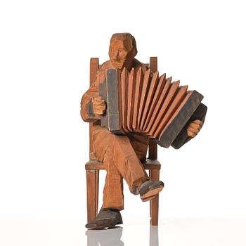 Axel Petersson Döderhultarn, Seated accordionist.