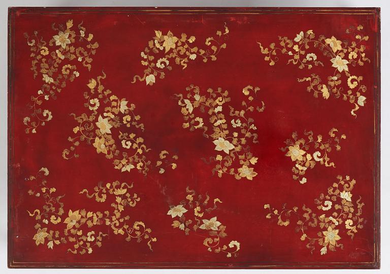 A Chinese red low table, 20th century.