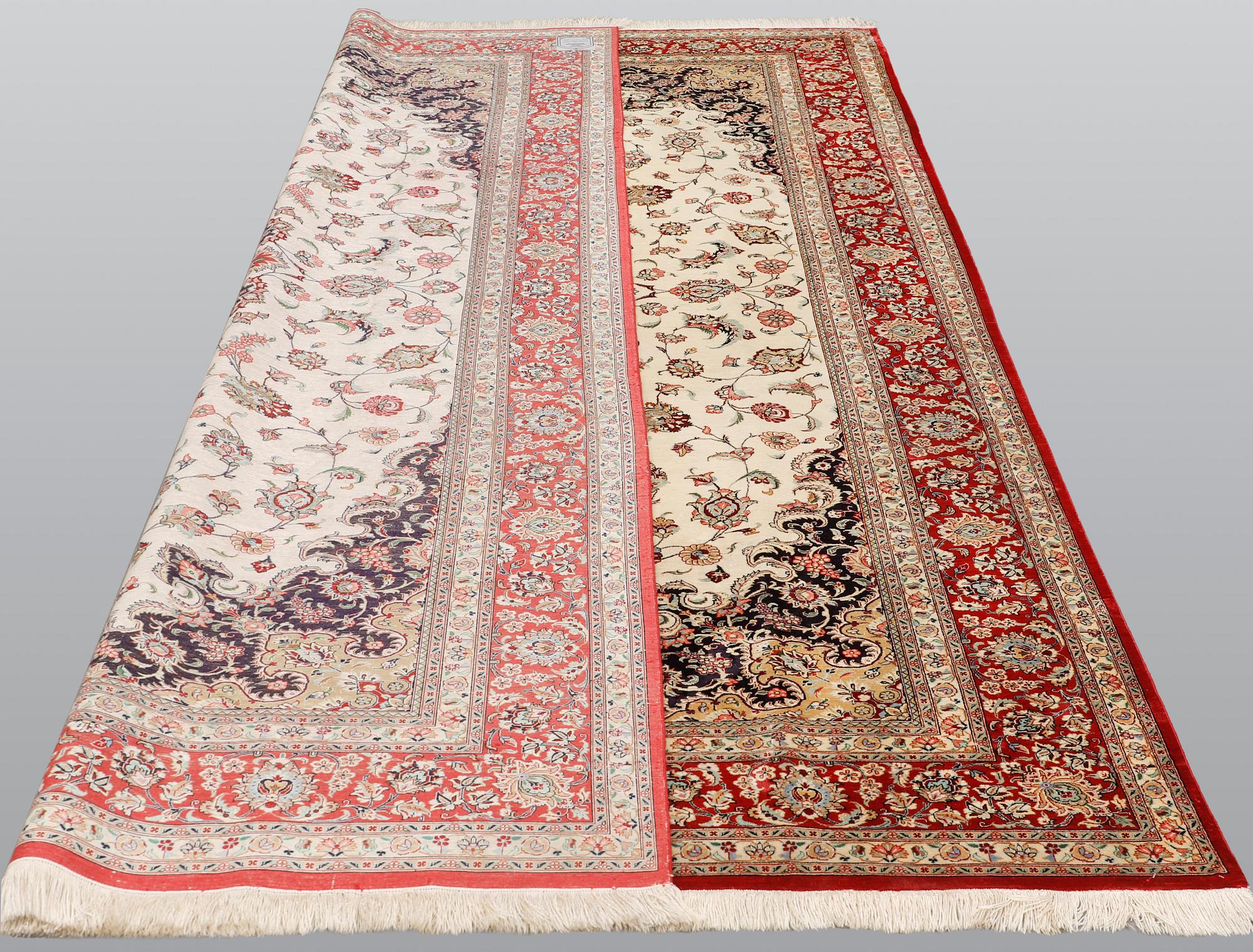 A silk Ghom carpet, 295 x 195 cm.