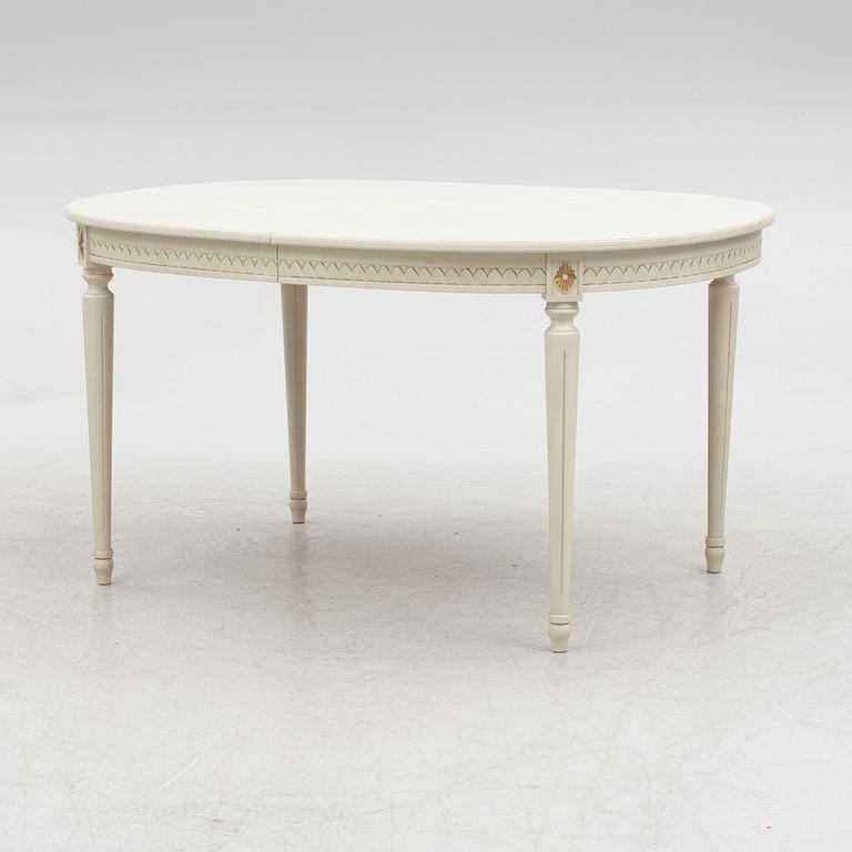 A Gustavian style dining table and eight chairs, late 20th century.