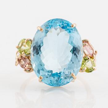 Large blue topaz, peridot, pink tourmalines and brilliant cut diamond cocktail ring.