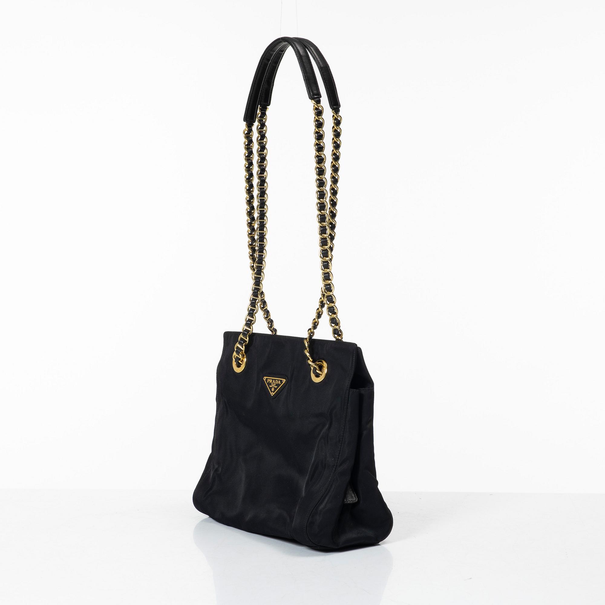 Prada, A black nylon bag.