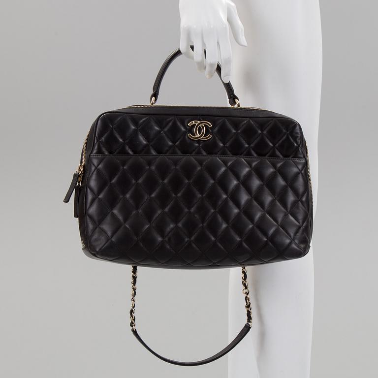 A black leather bag by Chanel 2014-2015.