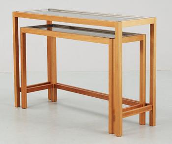 A Josef Frank set of mahogany and stainless steel tables by Svenskt Tenn.