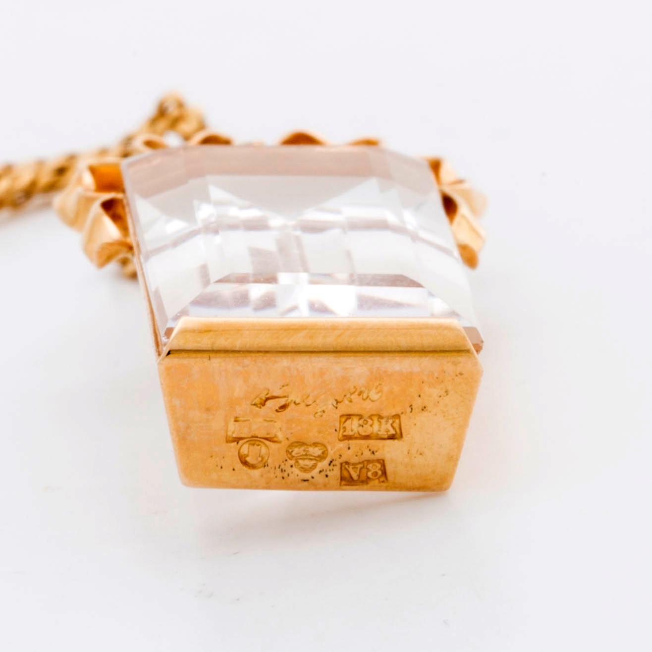 STIGBERT chainn and pendant and earrings, 18l gold and rock crystal.