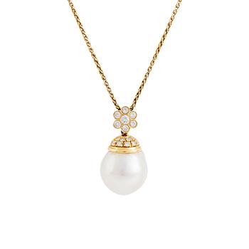 An 18K gold and cultured South Sea pearl pendant set with round brilliant-cut diamonds.