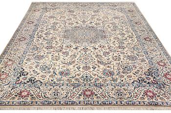 A Nain, part silk carpet, c. 474 x 322 cm.