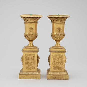 A pair of French Empire early 19th century gilt bronze urns.